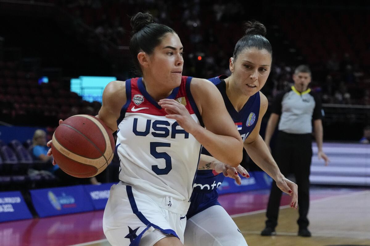 United States' Kelsey Plum attempt to win past Serbia's Sasa Cado during their quarterfinal game at the women's Basketball World Cup in Sydney, Australia, Thursday, Sept. 29, 2022. (AP Photo/Mark Baker)