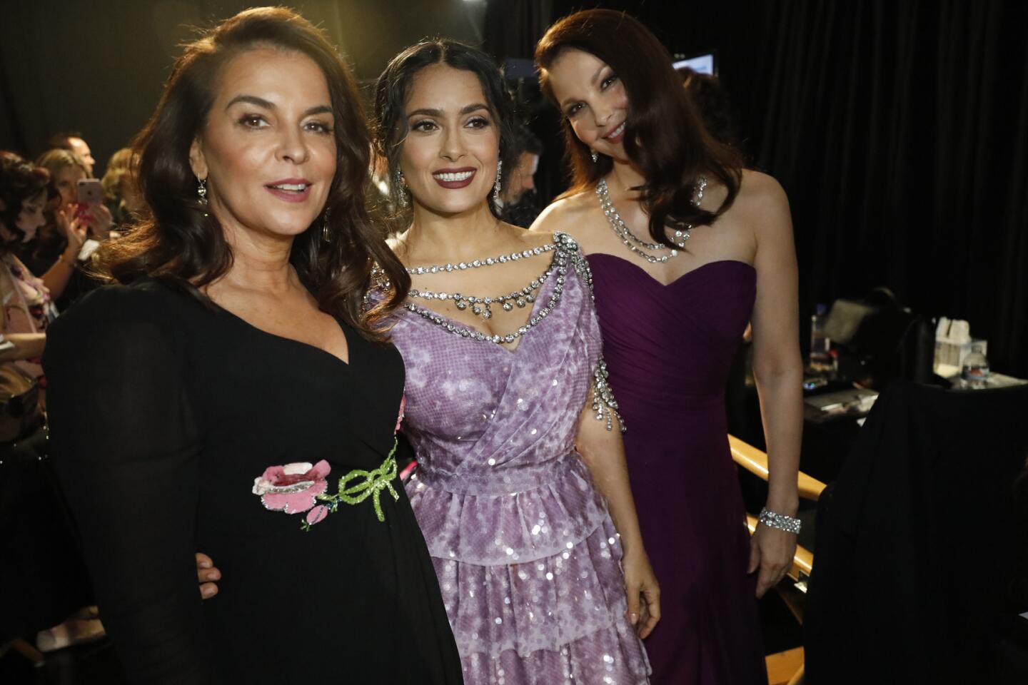 Annabella Sciorra, left, Salma Hayek and Ashley Judd backstage at the 90th Academy Awards on Sunday at the Dolby Theatre in Hollywood.