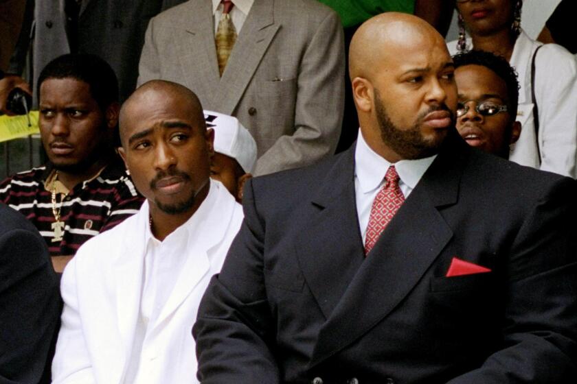 Marion "Suge" Knight, right, and Tupac Shakur at a 1996 voter registration event in South Los Angeles.