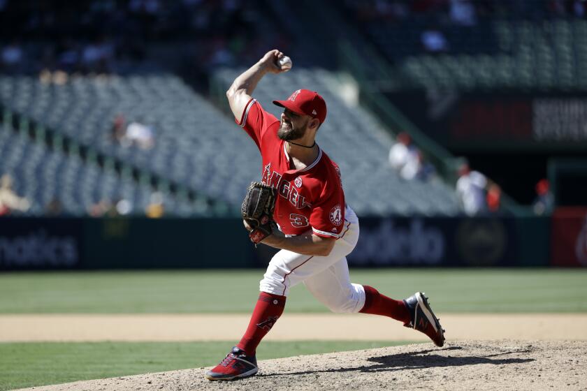 Los Angeles Angels relief pitcher Cam Bedrosian throws to the Seattle Mariners during a baseball game Sunday, July 14, 2019, in Anaheim, Calif. (AP Photo/Marcio Jose Sanchez)