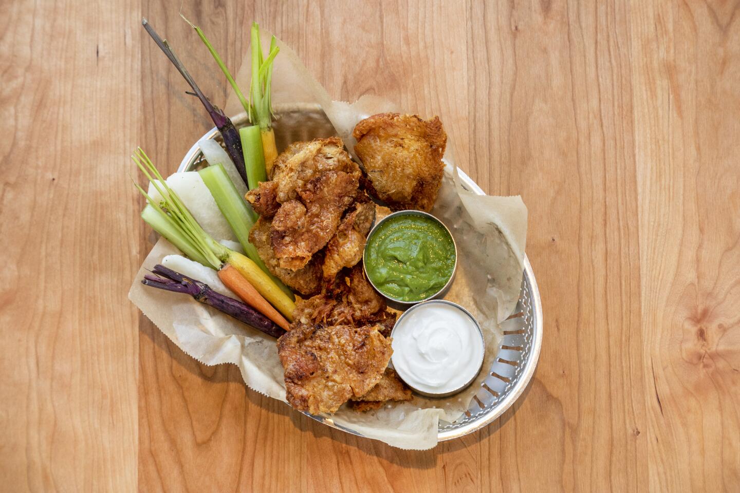 Crispy chicken skins with crudités