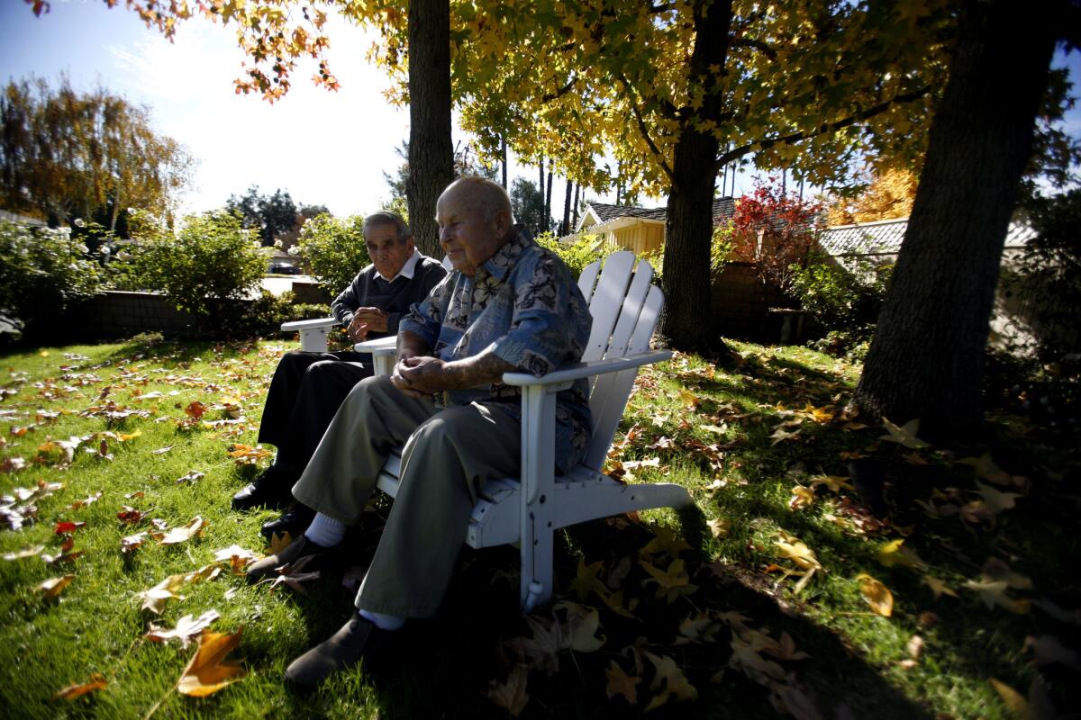 Pearl Harbor veterans Paul Perrault, 90, left, and Anthony "George" Mark, 87, have lived next door to each other in Monrovia for 50 years. They've bonded over things beyond the historic attack of 69 years ago.