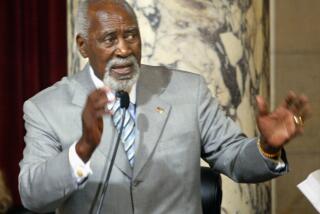 Los Angeles city councilman Nate Holden addresses the city council in favor of renaming Crenshaw Blvd after former Mayor Tom Bradley. Digital image taken on 06/25/03