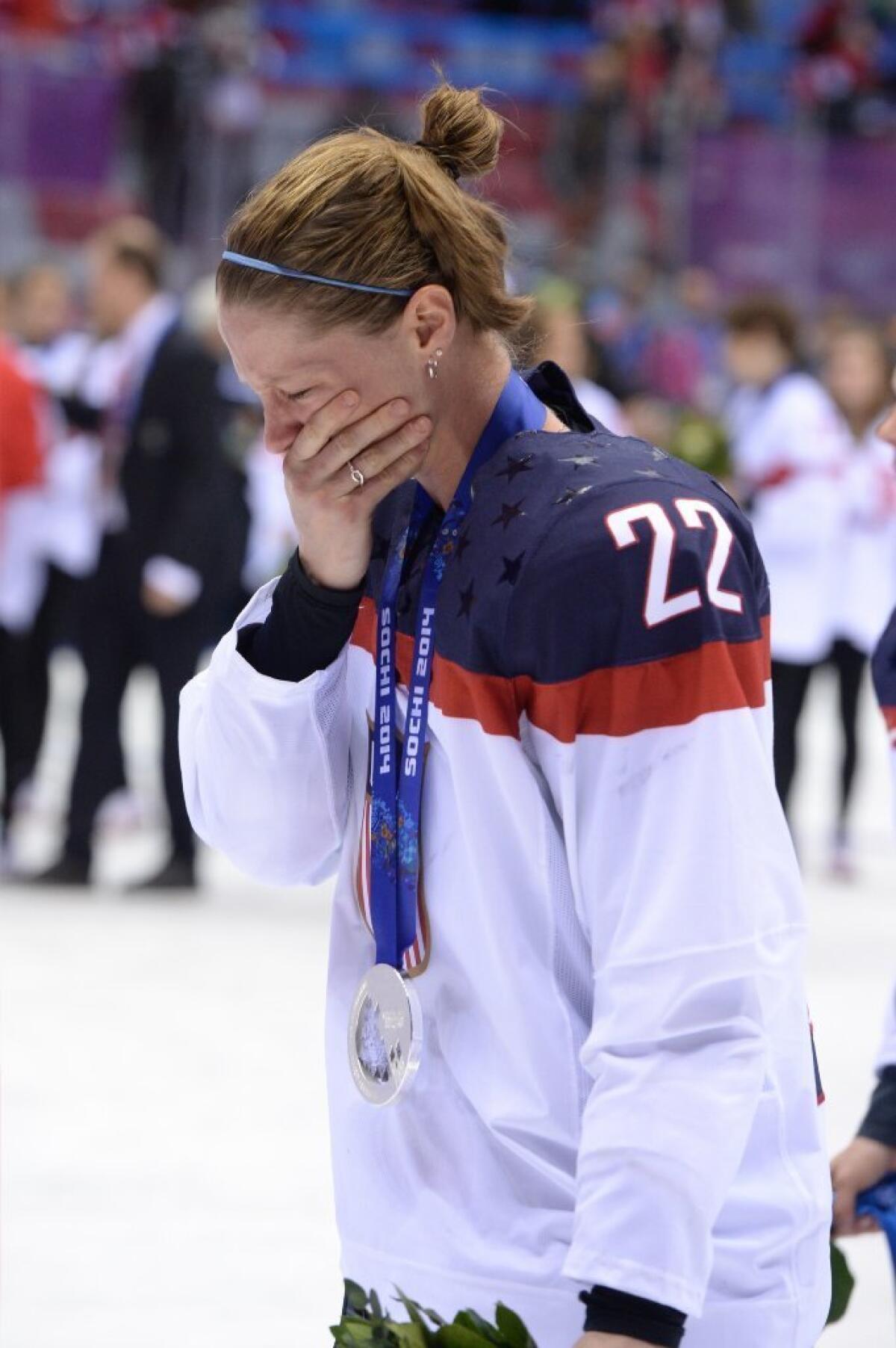 American hockey player Kacey Bellamy cries during the medal ceremony at the Sochi Winter Olympics.