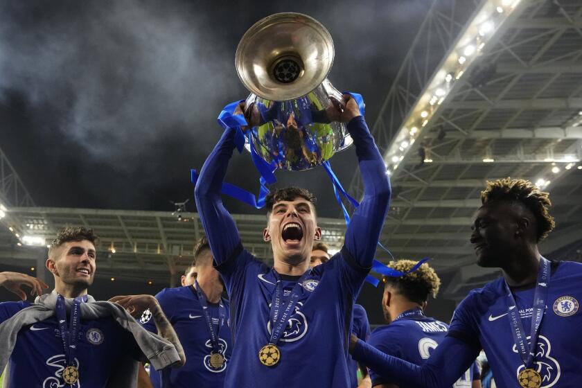 Kai Havertz celebrates with the trophy after Chelsea won the Champions League final against Manchester City on May 29, 2021.
