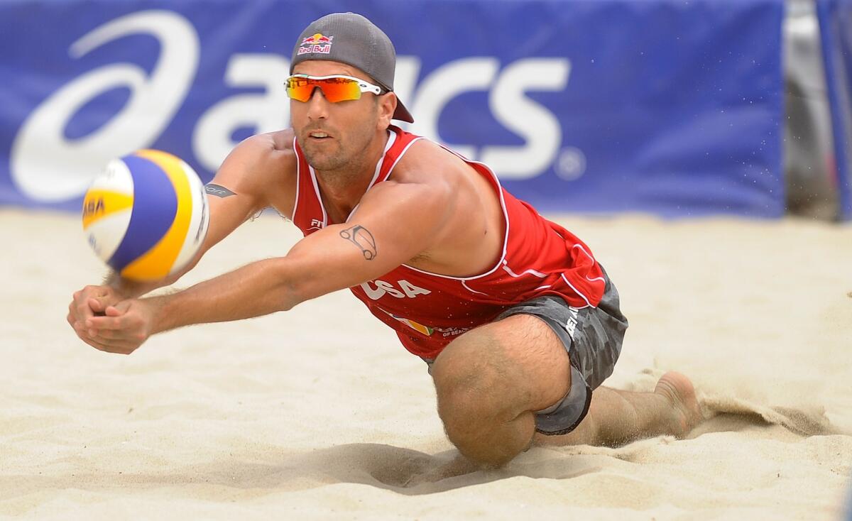 Sean Rosenthal makes a diving save against Poland during the gold medal match of the ASICS World Series of Volleyball in Long Beach on July 27.