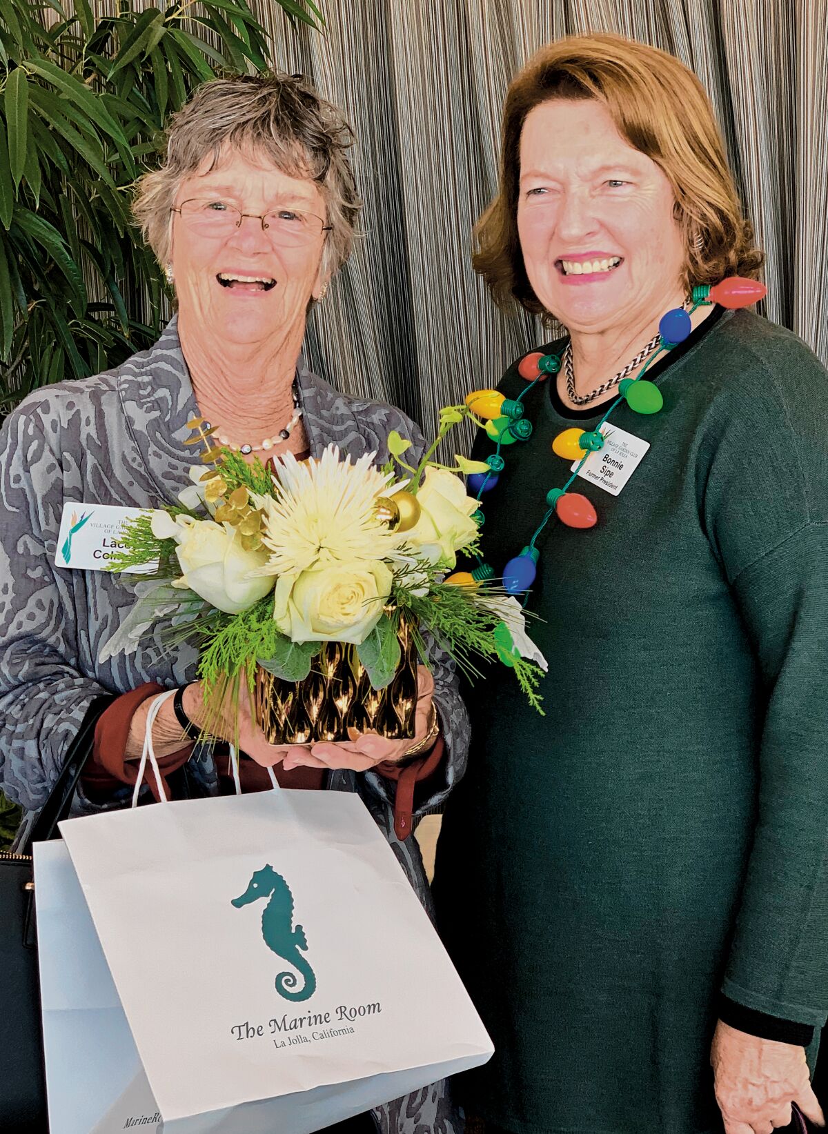 VGCLJ members Lacey Colmore and Bonnie Sipe attend the Village Garden Club of La Jolla's Holiday Luncheon, Dec. 12, 2019 at The Marine Room in La Jolla.