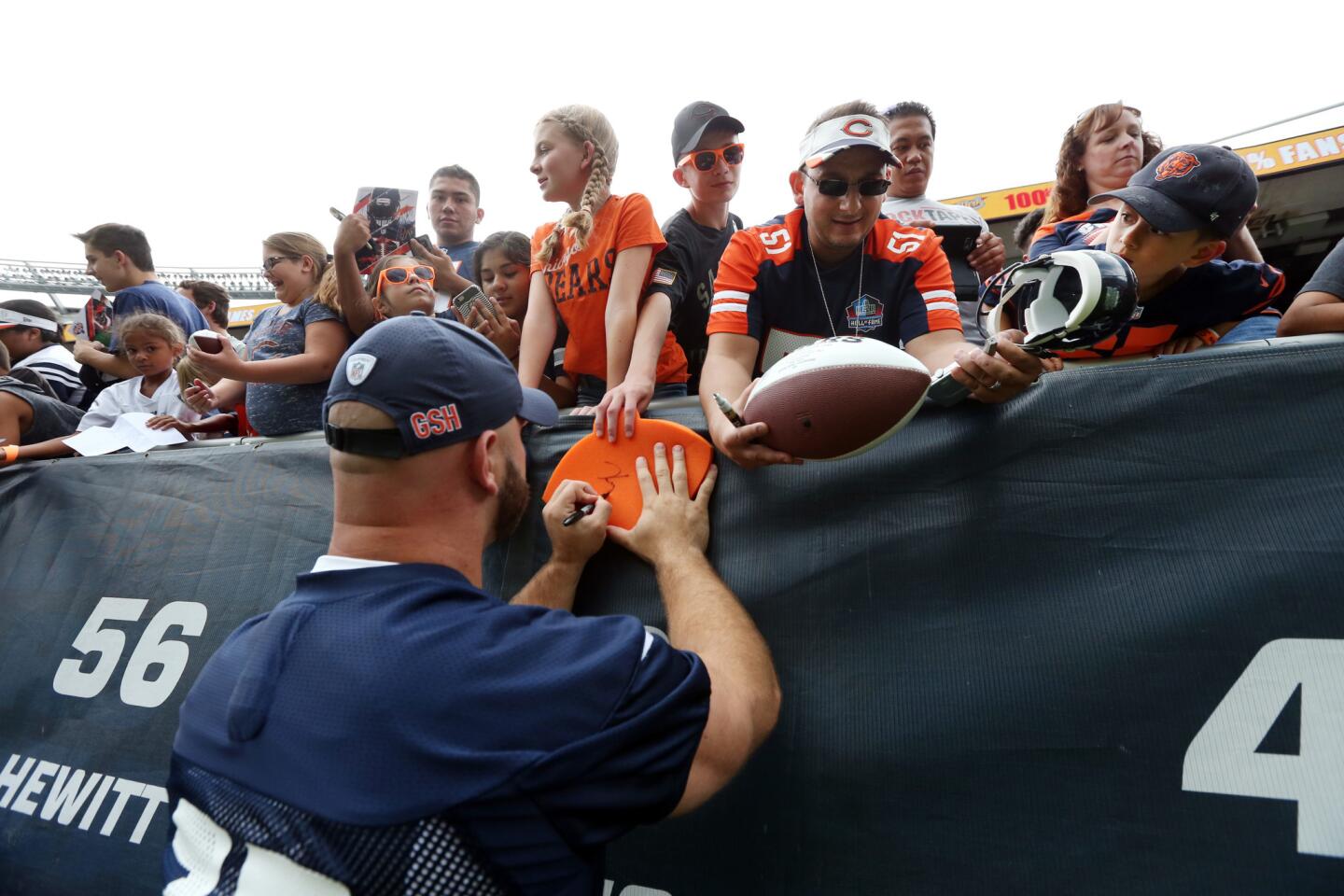 Kyle Long signs autographs during the Bears Family Fest at Soldier Field on Aug. 5, 2017.