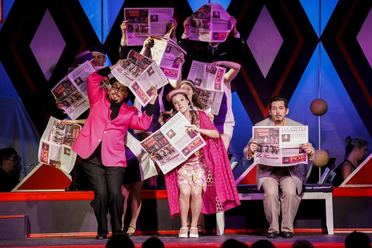 An opening scene of "La Gazzetta" by the Pacific Opera Project with Scott Ziemann, Jessie Schulman and Kyle Patterson, front, from left, at the Ebell Club in L.A.'s Highland Park.