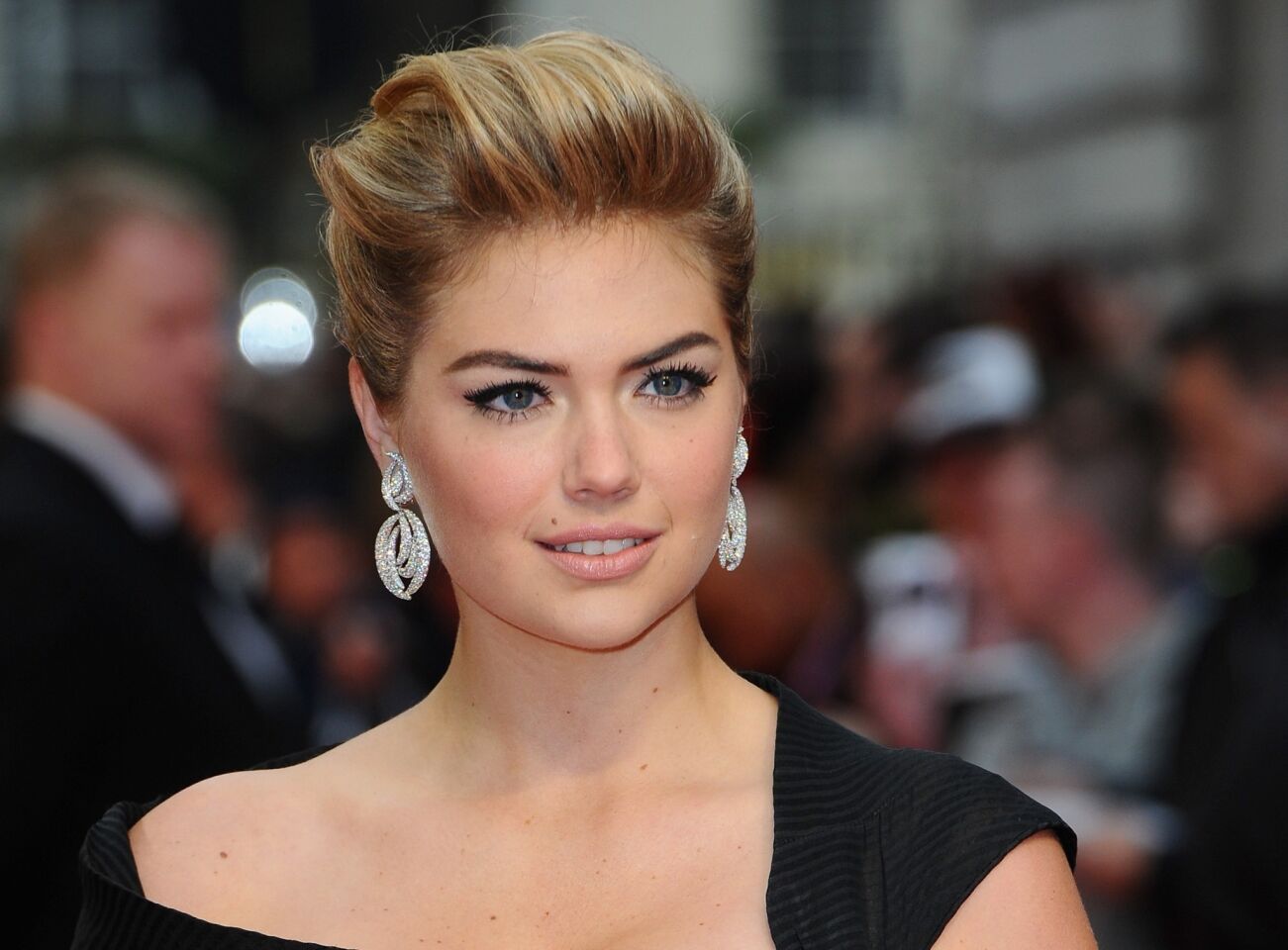 Kate Upton attends the London premiere of her comedy "The Other Woman" on Wednesday, wearing Adler earrings.
