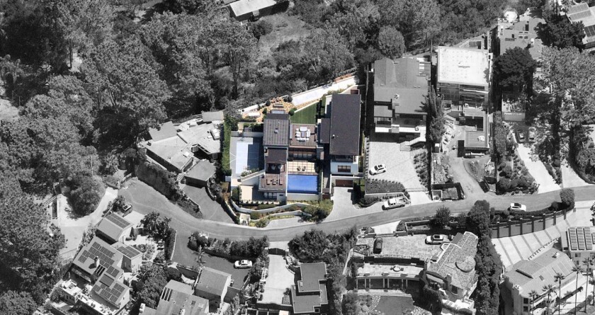 The custom compound, designed by L.A.-based firm KAA Design Group, sits on a half-acre hilltop in Del Mar.