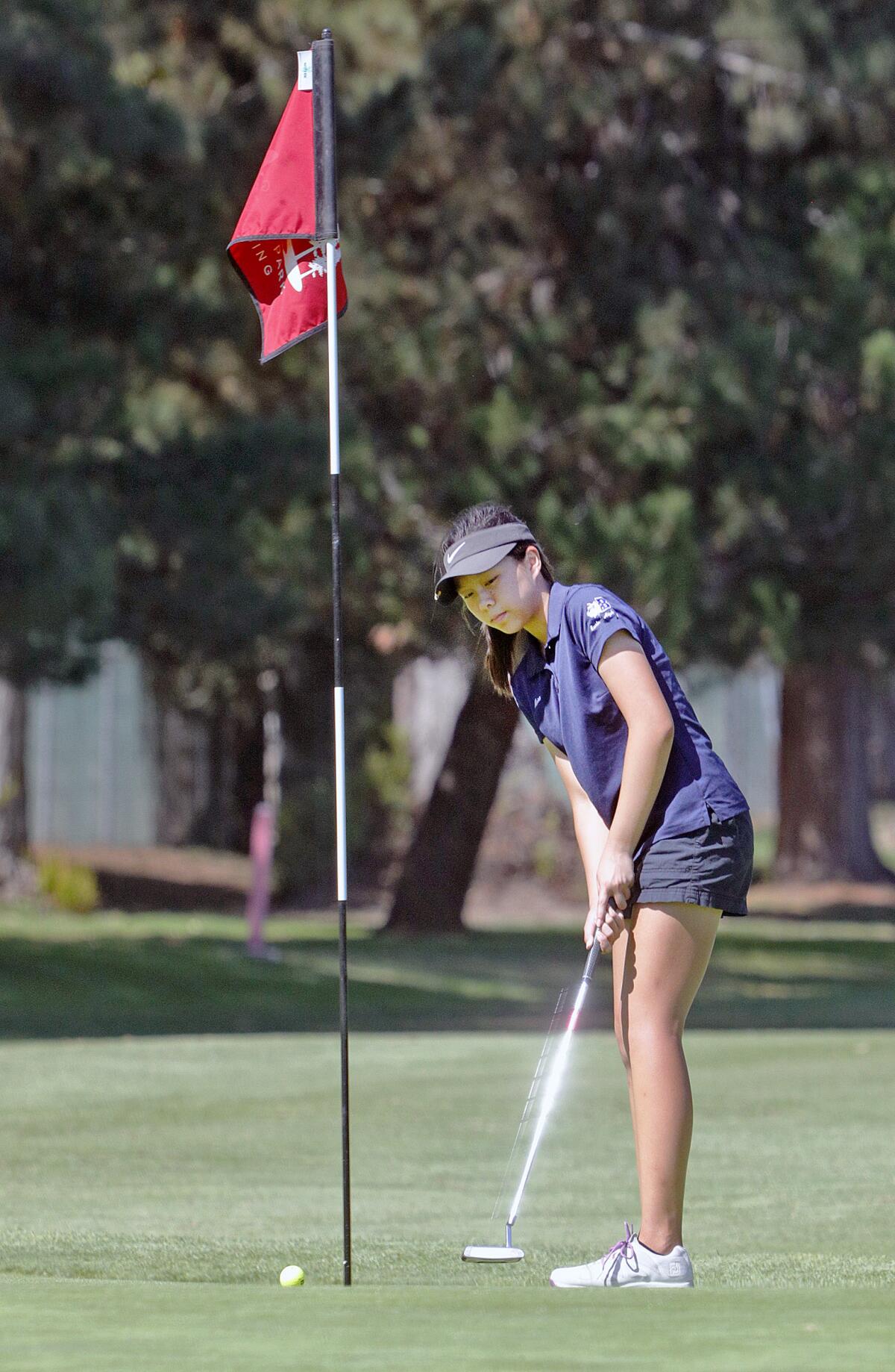 Burbank's Kara Lee putts on the third green in a Pacific League girls' golf match at Harding Golf Course in Los Angeles on Tuesday, September 24, 2019.