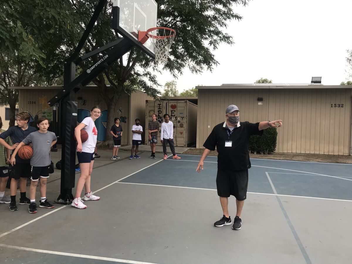 Ed Azzam coaches middle school students at Rolling Hills Prep during an outdoor practice.