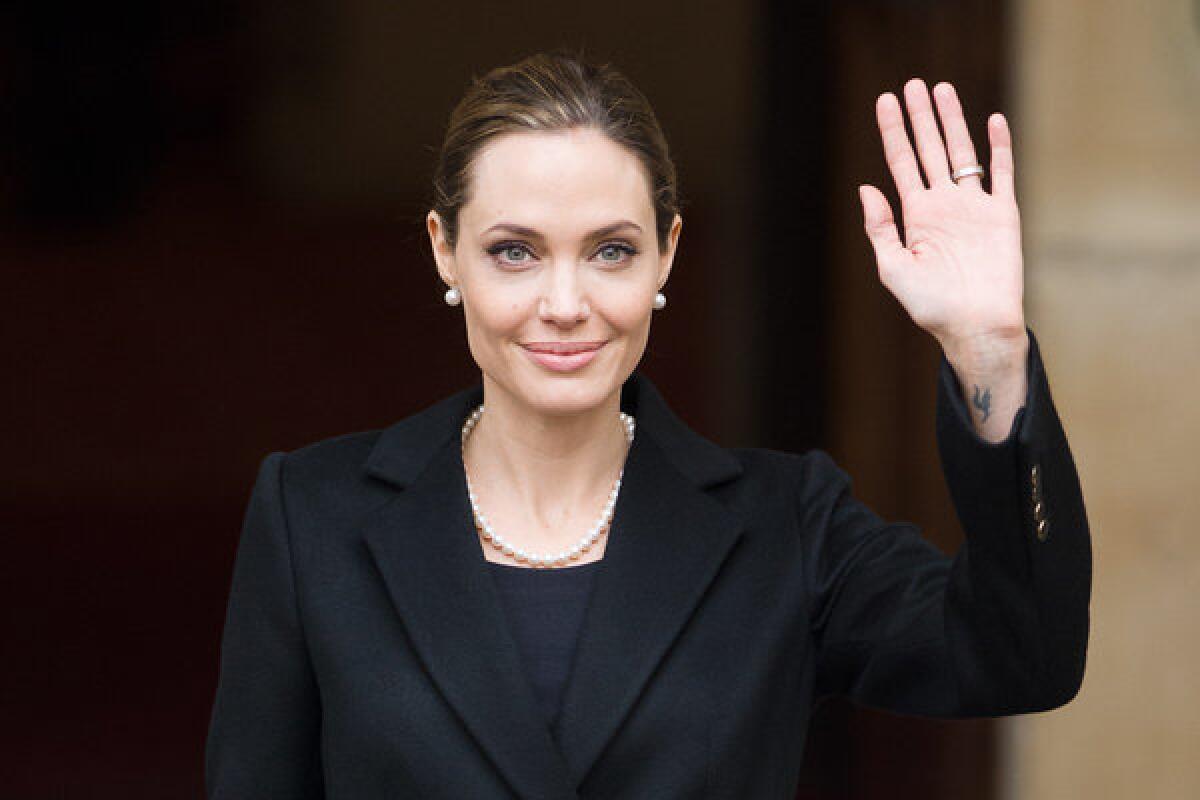 Angelina Jolie, seen here last month in London, has shown the importance for women to "know their cancer family history and discuss it with their regular [doctor]," an American Cancer Society official says.