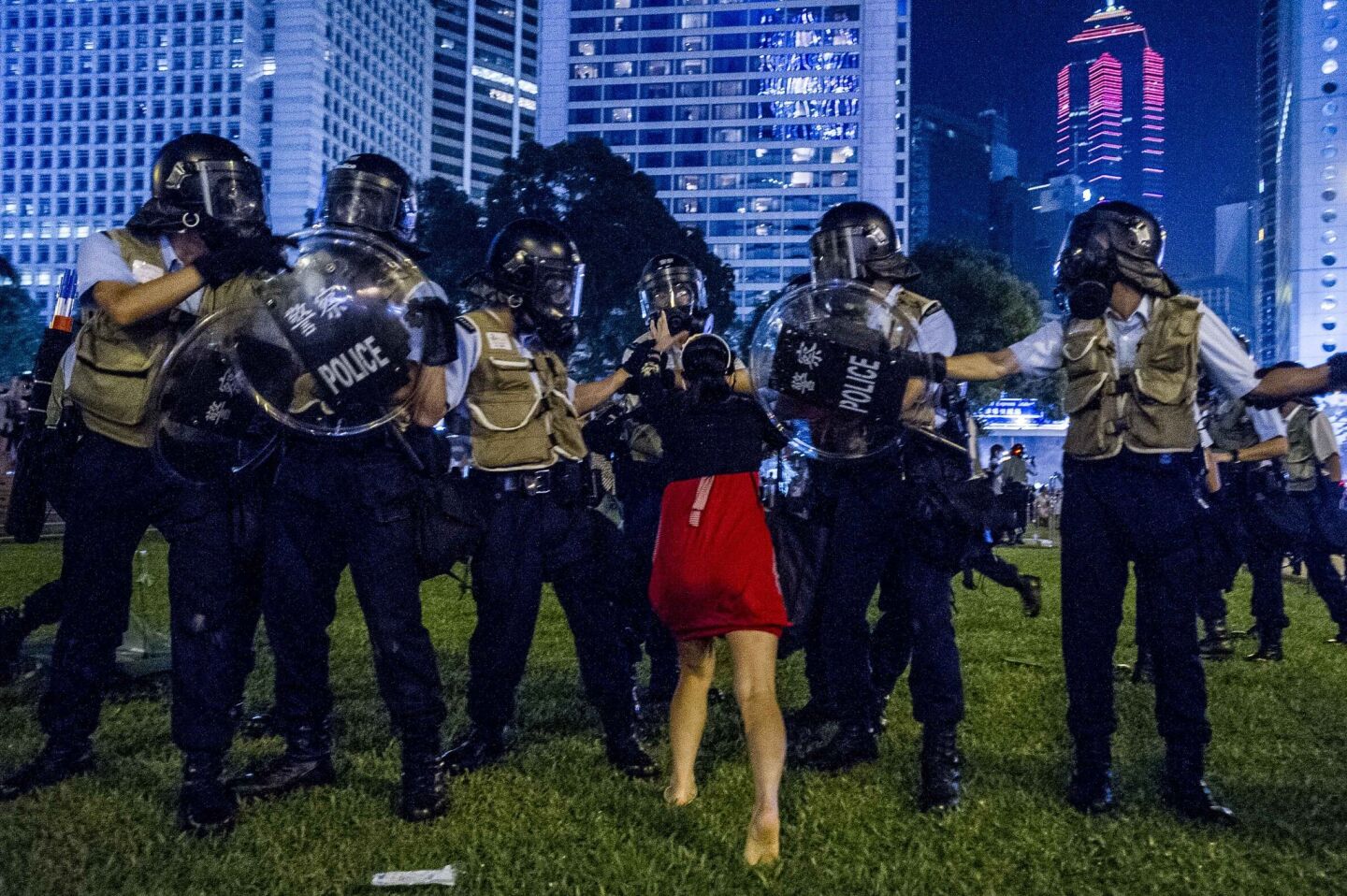 A pro-democracy protester confronts the police during a demonstration in Hong Kong.
