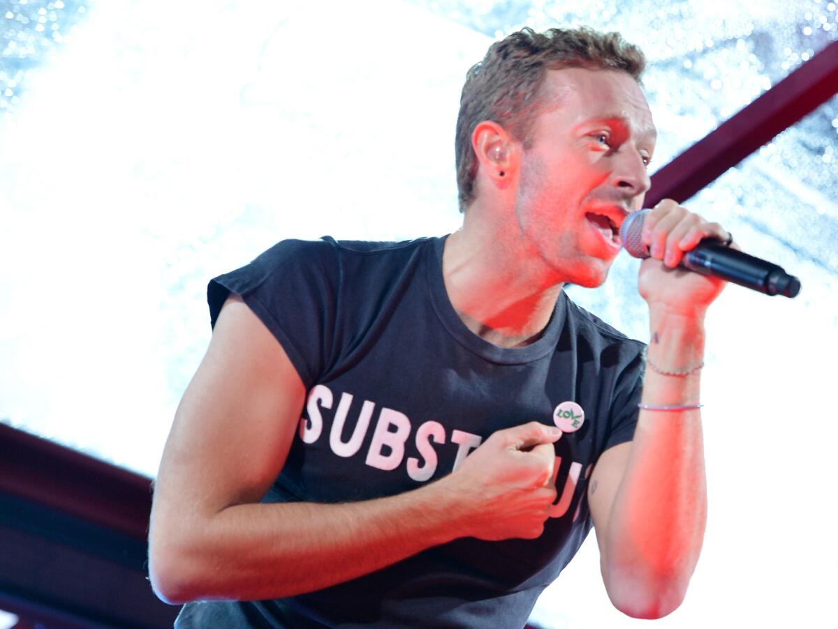 Chris Martin lightheartedly explains how he came to write "Miracles" for the "Unbroken" soundtrack.