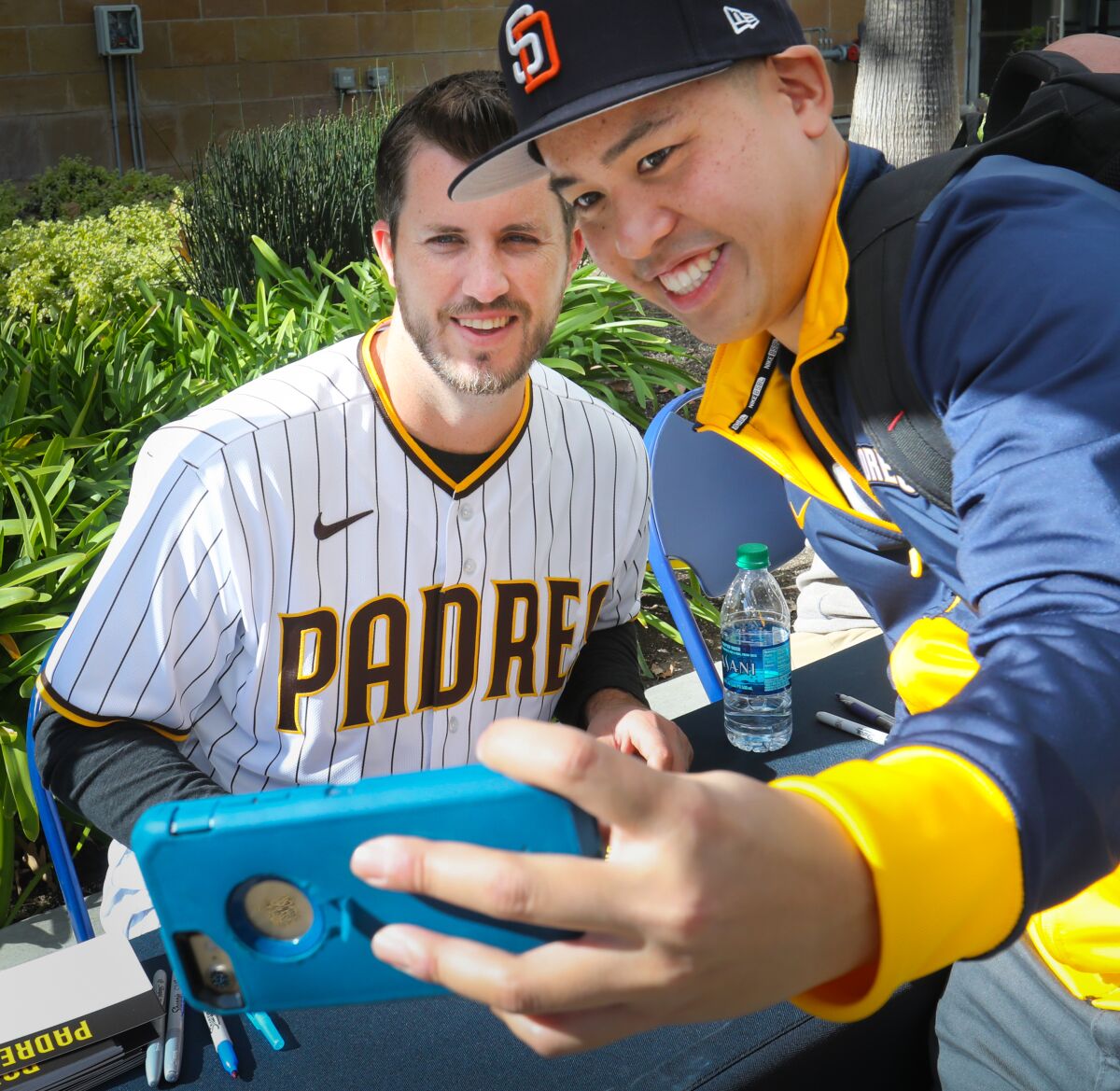 Vincent Pham of Mira Mesa takes a selfie photo with San Diego Padres pitcher Drew Pomeranz during Padres FanFest 2020 on Saturday at Petco Park.