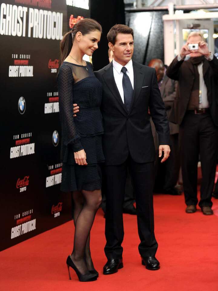 Tom Cruise, with wife Katie Holmes, hit the red carpet at Ziegfeld Theatre in New York Monday night to celebrate the opening of "Mission: Impossible - Ghost Protocol." In the latest installment, Cruise's character IMF agent Ethan Hunt and his pals go rogue after being framed for a bombing in Russia.