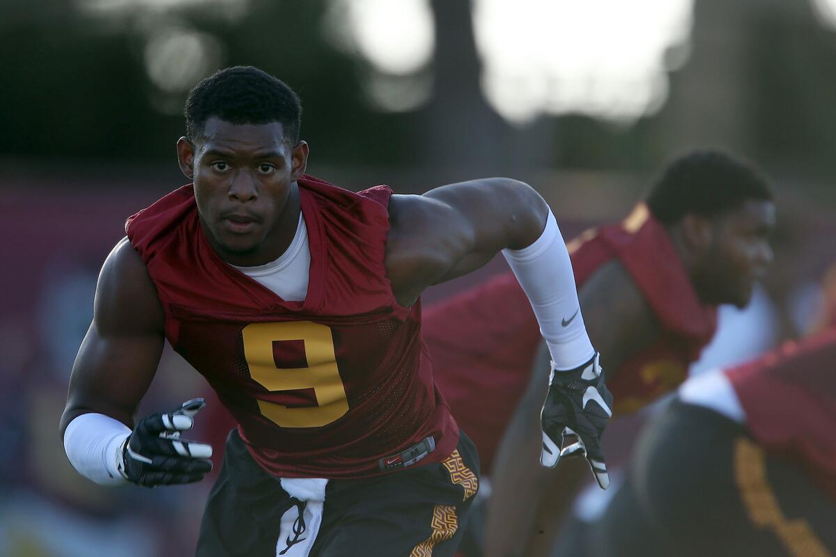 USC receiver JuJu Smith-Schuster runs a route on the first day of training camp Aug. 8.
