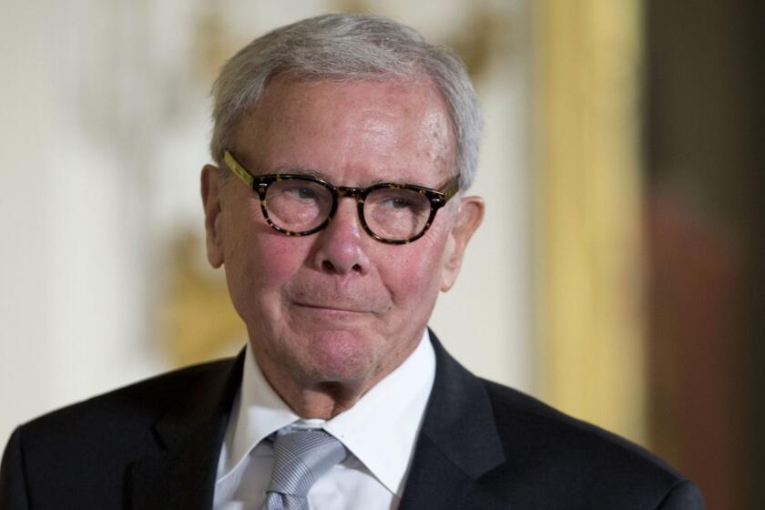 FILE - In this Nov. 24, 2014, file photo, journalist Tom Brokaw is introduced before being awarded the Presidential Medal of Freedom during a ceremony in the East Room of the White House in Washington. A woman who worked as a war correspondent for NBC News says Brokaw groped her, twice tried to forcibly kiss her and made inappropriate overtures attempting to have an affair. (AP Photo/Pablo Martinez Monsivais, File)