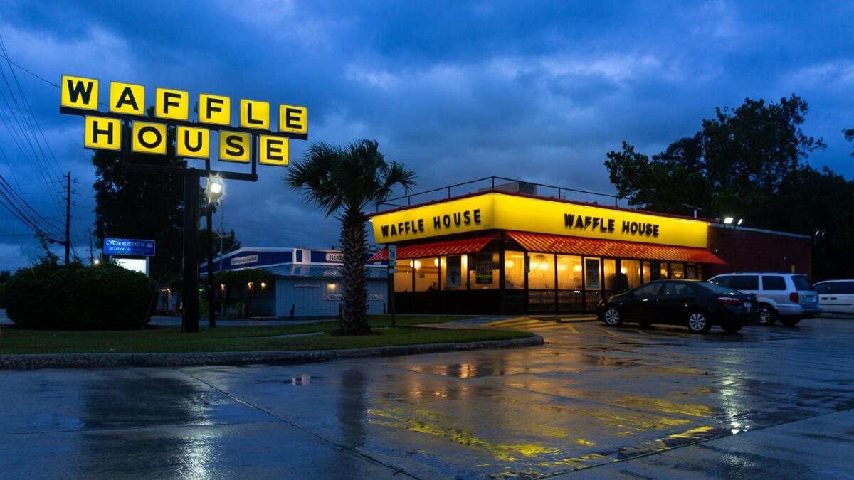 Waffle House staff in Wilmington, N.C. say they plan to stay open through Hurricane Florence despite torrential rain and harsh winds.