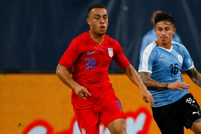 ST LOUIS, MO - SEPTEMBER 10: Sergiño Dest #18 of the United States Mens National Team looks to beat Brian Rodriguez #16 the Uruguay Men's National Team tot he ball at Busch Stadium on September 10, 2019 in St Louis, Missouri. (Photo by Dilip Vishwanat/Getty Images)