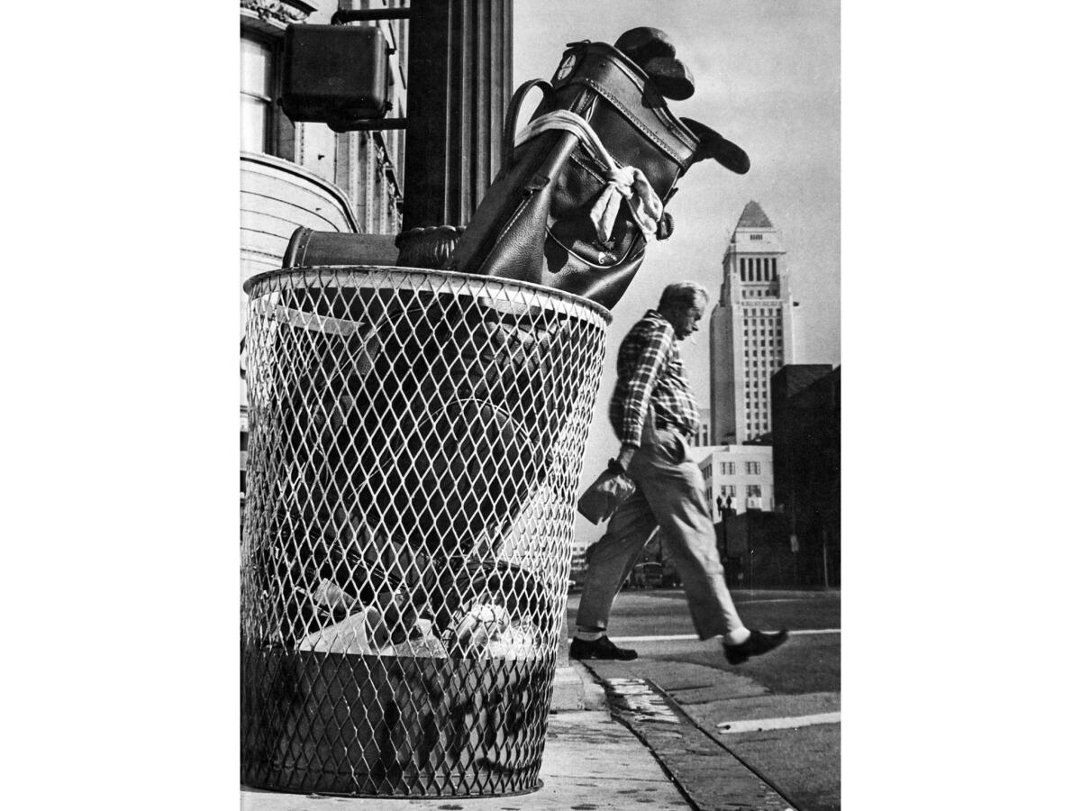 Nov. 5, 1974: Golf bag left in trash at 4th and Spring streets in downtown Los Angeles.