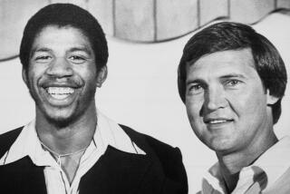 Magic Johnson, left, and Jerry West in a black-and-white photo from May 16, 1979