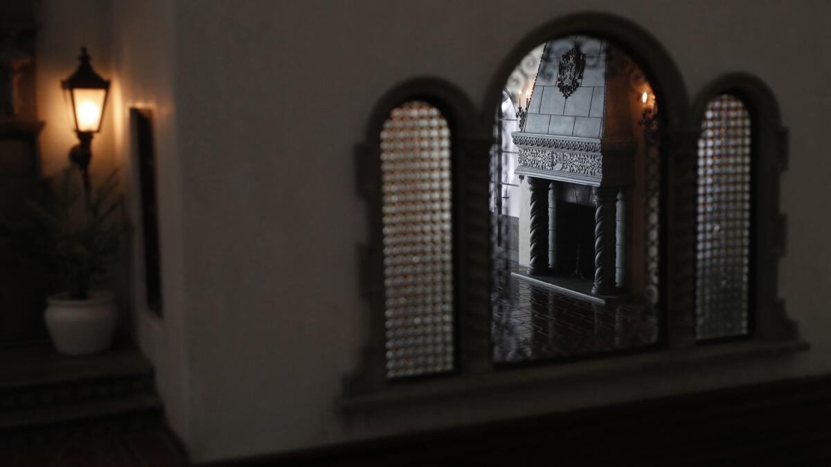 A fireplace in the living room is viewed through the window. (Mel Melcon / Los Angeles Times)