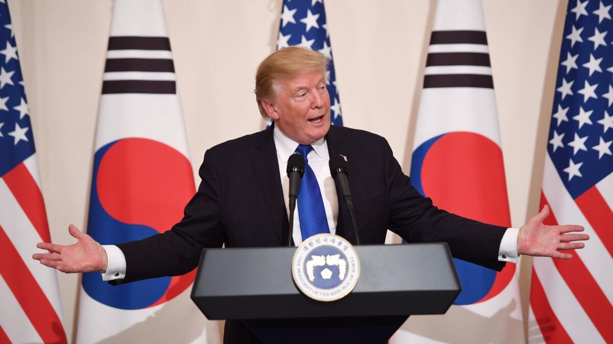 President Trump gestures during a press conference Tuesday at South Korea's Blue House in Seoul.