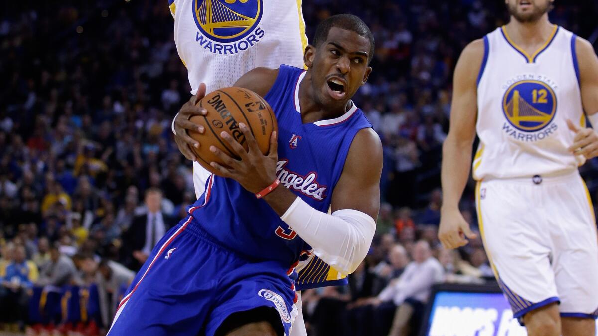 Clippers point guard Chris Paul drives to the basket during the first half of Wednesday's game against the Golden State Warriors.