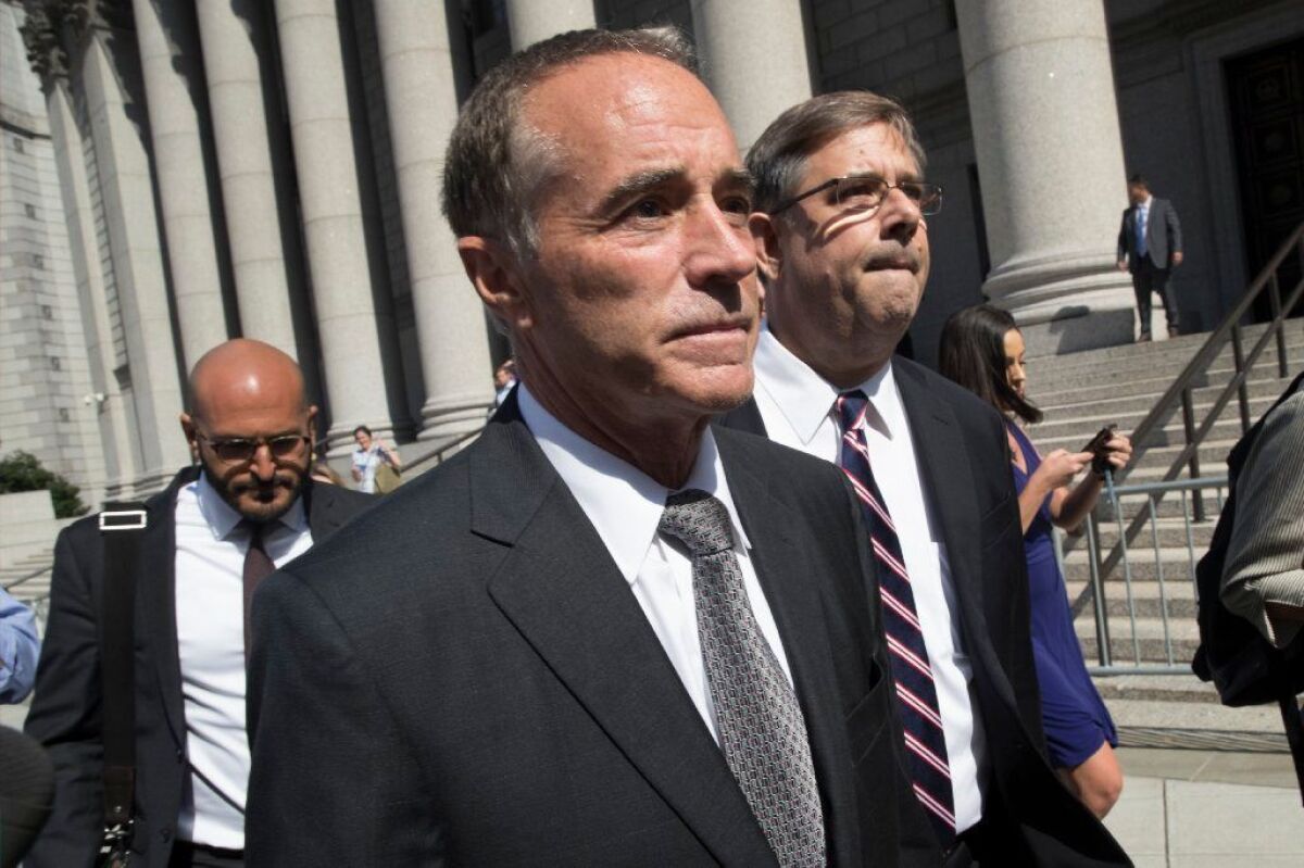 Republican U.S. Rep. Christopher Collins leaves federal court in New York. Collins was indicted on charges that he used inside information about a biotechnology company to make illicit stock trades.