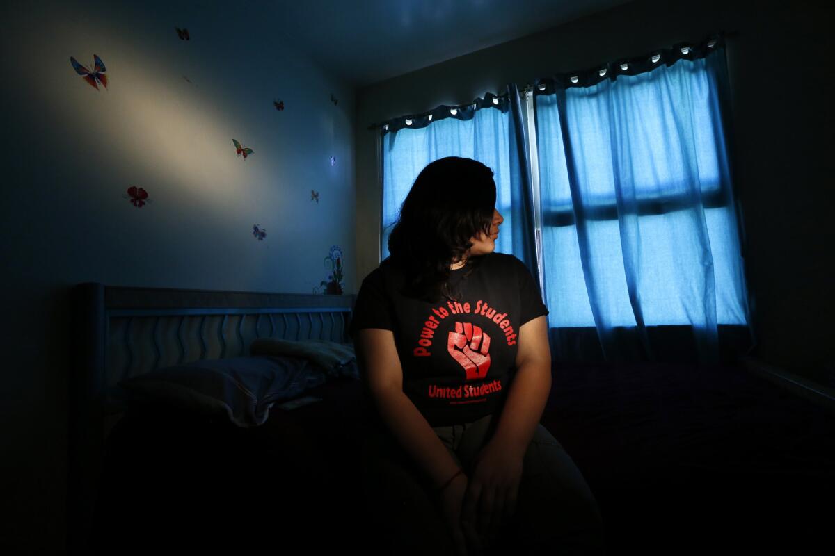 Lupe, 15, a U.S. citizen, sits in her bedroom in Los Angeles on April 11, 2017.