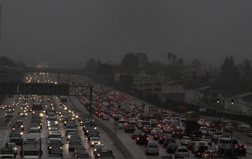 Traffic backed up on the 405 Freeway early this month beneath a steady Southern California rain.
