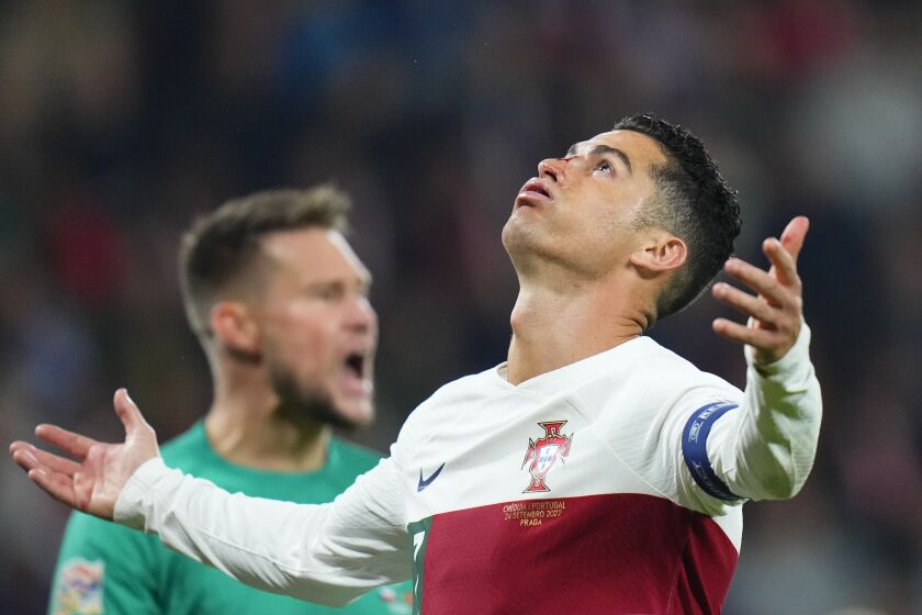 Portugal's Cristiano Ronaldo reacts after missing a chance to score as Czech Republic goalkeeper Tomas Vaclik, rear, screams during the UEFA Nations League soccer match between the Czech Republic and Portugal at the Sinobo stadium in Prague, Czech Republic, Saturday, Sept. 24, 2022. (AP Photo/Petr David Josek)