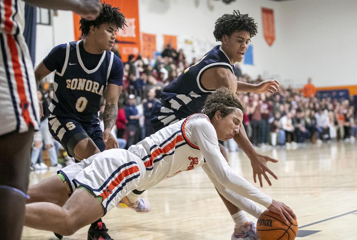 Pacifica Christian's Logan Stewart scrambles for a ball against Sonora's Yanmife Oke during Tuesday's playoff quarterfinal.