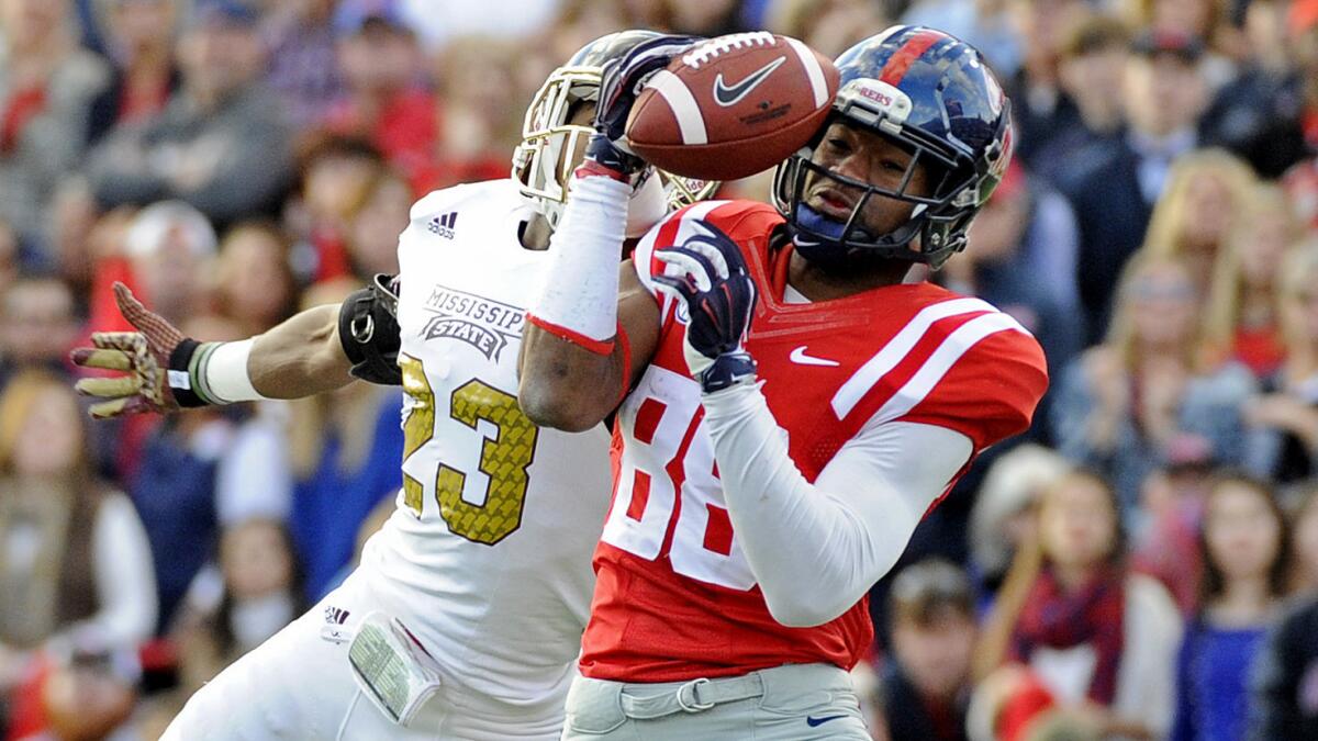 Mississippi State defensive back Taveze Calhoun, left, breaks up a pass intended for Mississippi wide receiver Cody Core during the Rebels' upset victory.