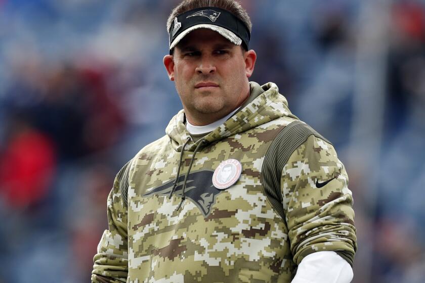 FILE - New England Patriots offensive coordinator Josh McDaniels looks on prior to an NFL football game Nov. 14, 2021, in Foxborough, Mass. The Las Vegas Raiders have made a request to interview the Patriots' McDaniels for their head coach opening. A person familiar with the search said Thursday, Jan. 27, 2022, the Raiders made the request to speak with McDaniels about filling the void left when Jon Gruden resigned in October. The person spoke on condition of anonymity because the team was not announcing its candidates. (AP Photo/Michael Dwyer, File)