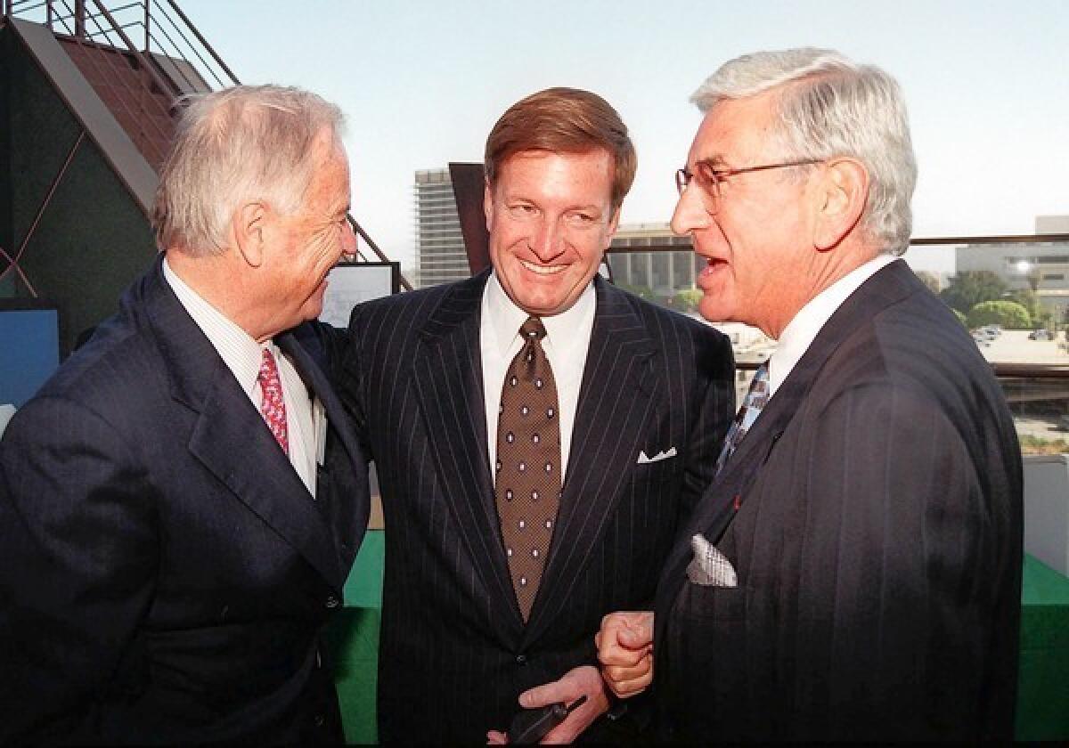 In a 1997 photo, Los Angeles Mayor Richard Riordan, left, talks with Ron Burkle, center, and Eli Broad after a $15-million gift was donated to the Walt Disney Concert Hall project.