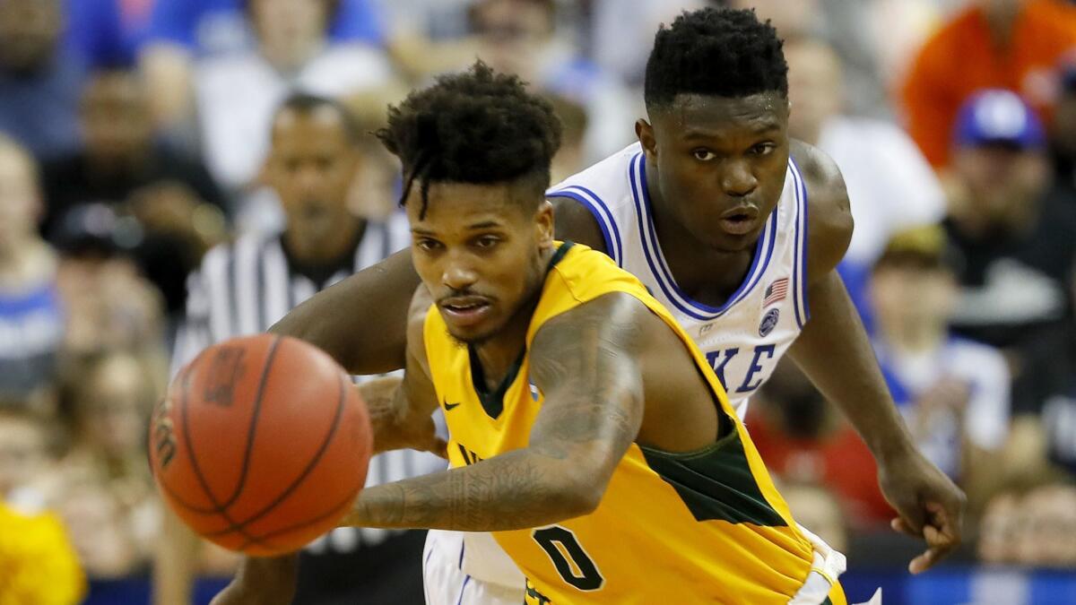 North Dakota State's Vinnie Shahid, left, is pursued by Duke's Zion Williamson in the second half during the first round of the NCAA Men's tournament at on Friday in Columbia, S.C.