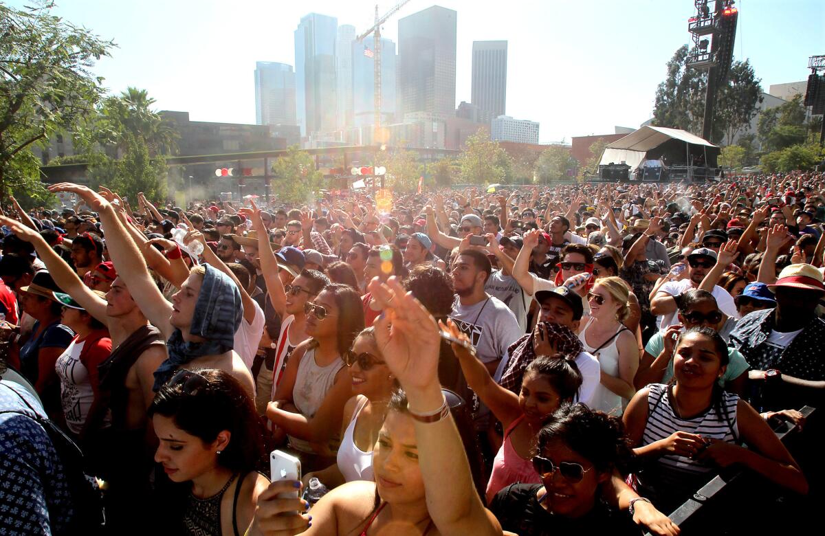 Music fans watch a performance by Cypress Hill at the Made In America Festival in downtown Los Angeles on Sunday.