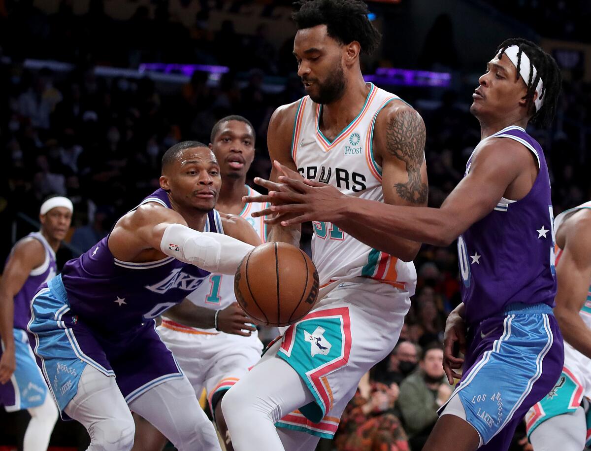 Lakers guard Russell Westbrook fouls San Antonio Spurs forward Keita Bates-Diop.