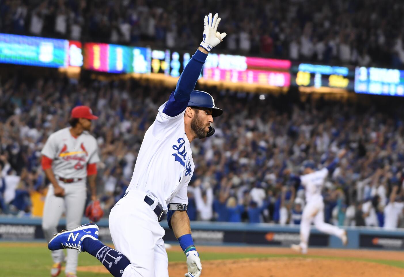 Los Angeles, CA - October 06: Los Angeles Dodgers left fielder Chris Taylor celebrates while rounding the basesafter hitting the game-winning two-run home run during the ninth inning against the St. Louis Cardinals at Dodger Stadium on Wednesday, Oct. 6, 2021 in Los Angeles, CA. (Wally Skalij / Los Angeles Times)