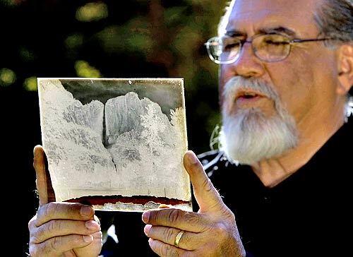 GENUINE?: Rick Norsigian holds one of the glass negatives he insists were made by Adams.