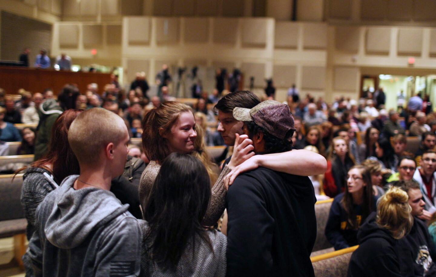 Members of the community pray before the start of the Kalamazoo Community Prayer Service at Centerpoint Church on in Kalamazoo, Mich., Sunday, Feb 21, 2016.