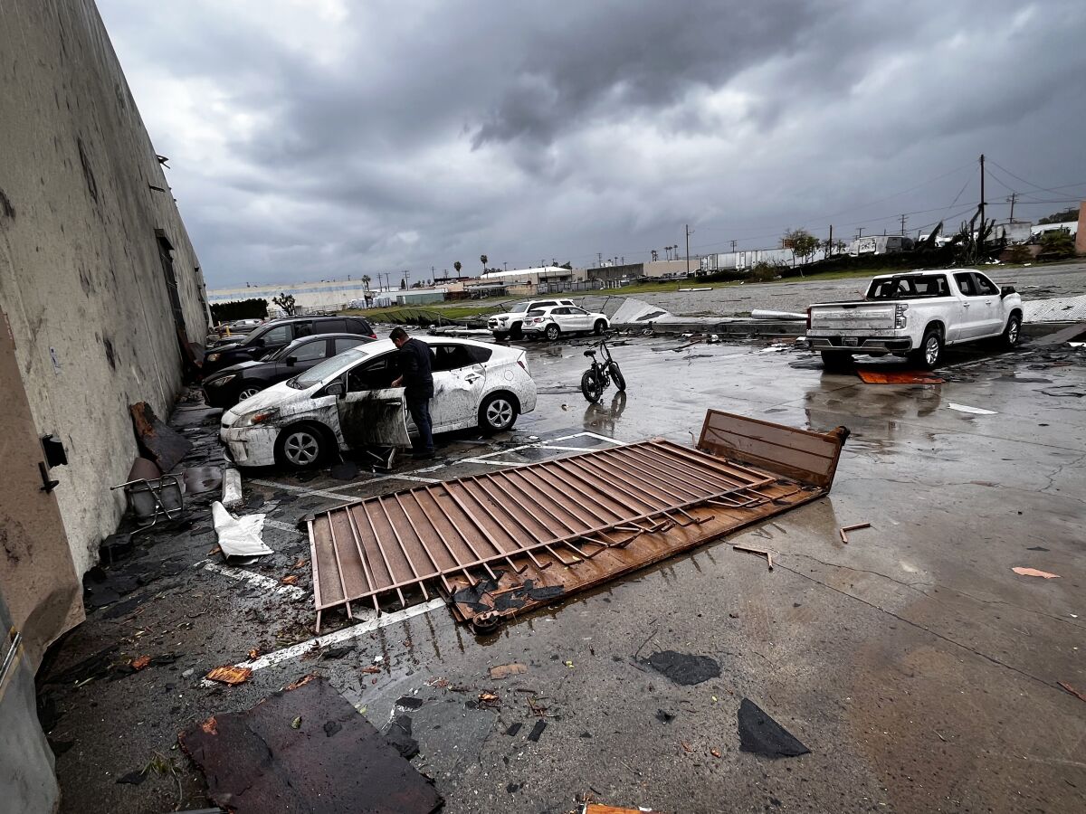 Debris is strewn about outside the Royal Paper Box Company in Montebello
