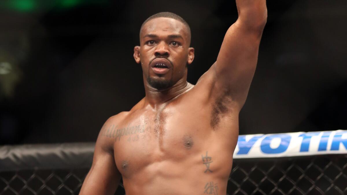 Jon Jones celebrates after beating Chael Sonnen in a UFC heavyweight title bout on April 27, 2013.