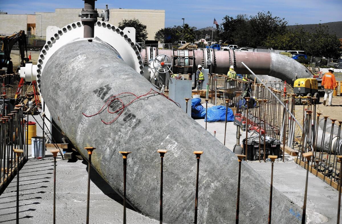 Pipes are installed to carry water from the Poseidon Water desalination plant in Carlsbad, which is scheduled to open in November.