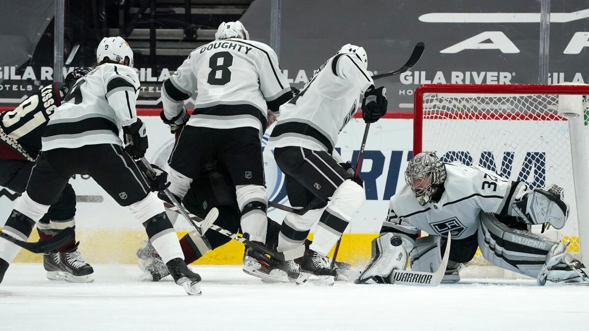 Los Angeles Kings goaltender Darcy Kuemper gets a pad on a shot on
