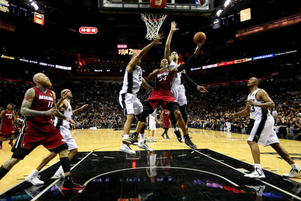 Ray Allen of the Miami Heat goes to the basket against the San Antonio Spurs in Game 1 of the NBA Finals on Thursday night.